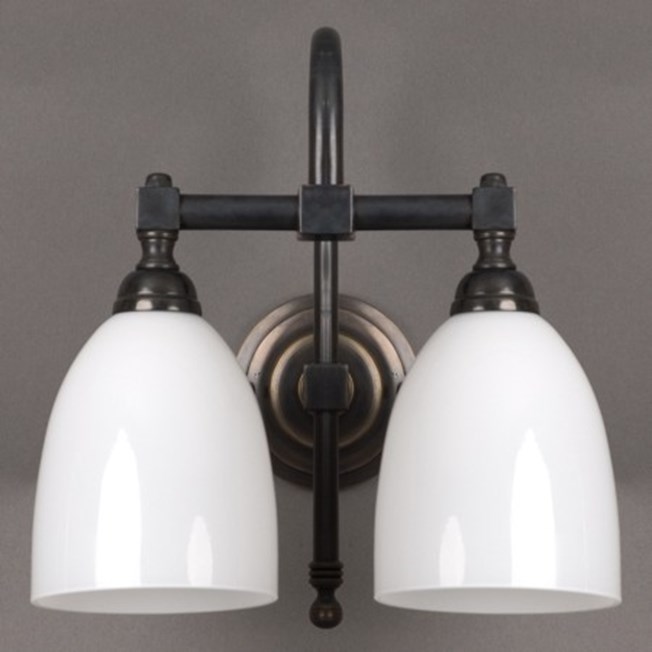 Bathroom wall lamp with bronze armature and opal white glass shades