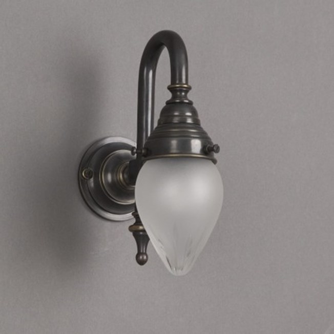 Bathroom wall lamp with bronze armature and small, ellips shaped, etched glass shade